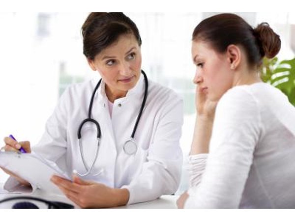 Woman talking with doctor