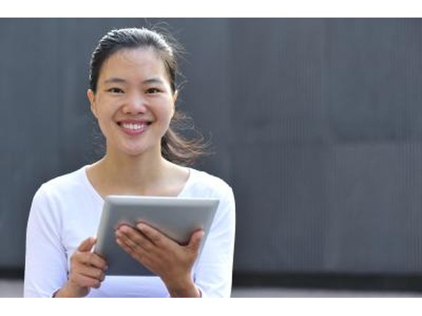 lead teacher holding digital tablet