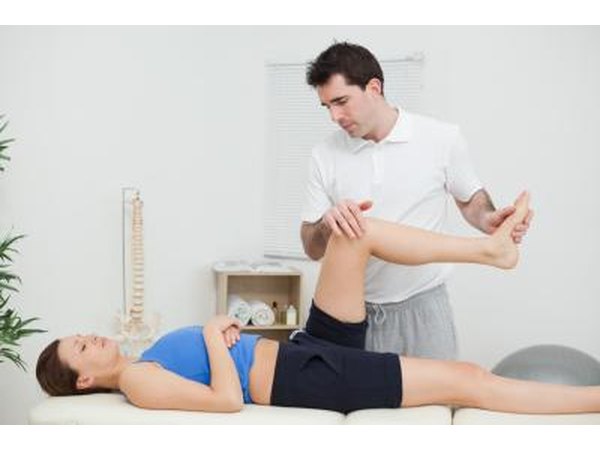 Man helping woman raise legs after injury.