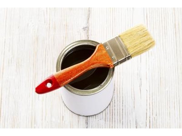 A lacquer can with brush.