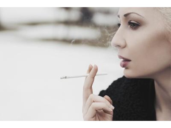 Woman smoking outdoors.