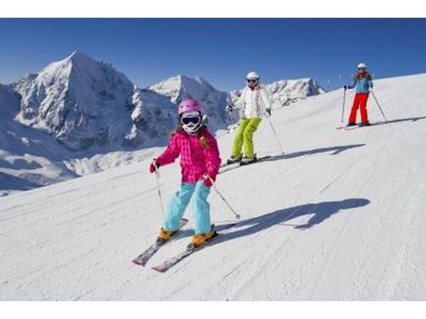 children skiing down slopes