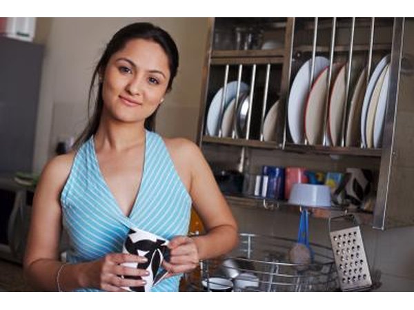 woman with glass in kitchen