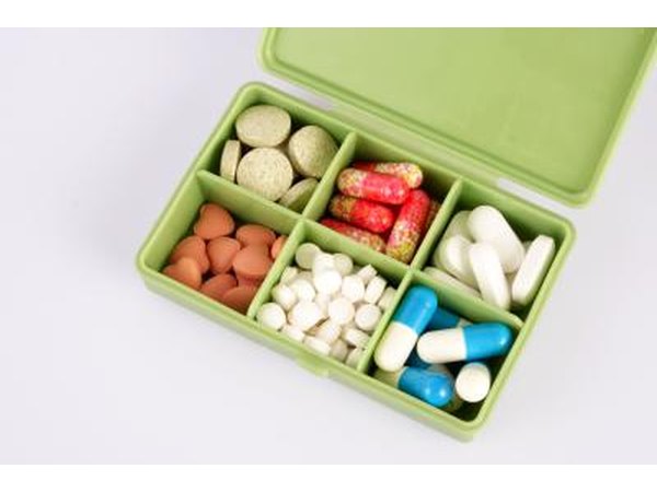 box of iron supplements, vitamin C and other medications