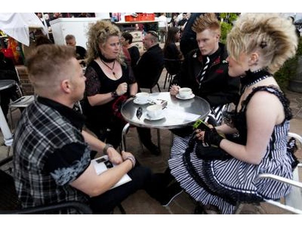 Goth music festival attendees take a refreshment break