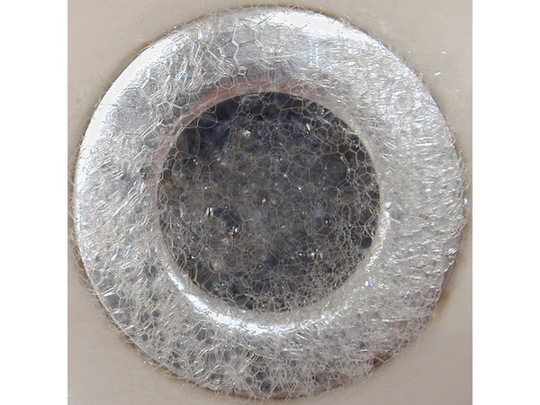 Bubbles in a tub drain.