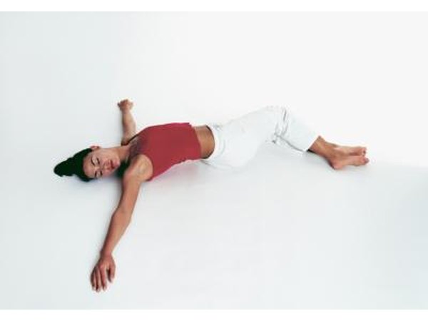 Drop both knees to one side and gaze over the opposite shoulder.