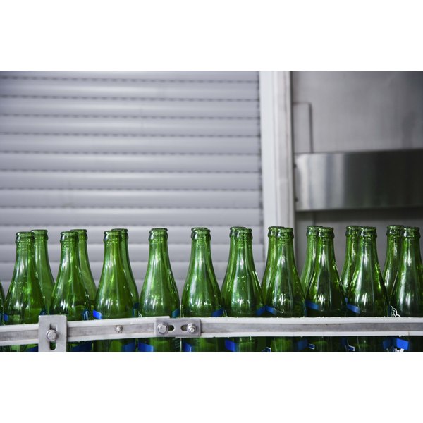 Jupiterimages/Comstock/Getty Images Empty beer bottles on assembly line at a brewery