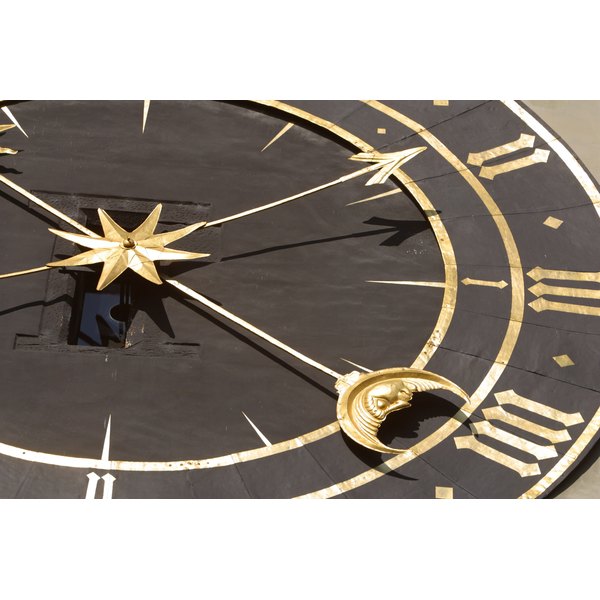 Hemera Technologies/AbleStock.com/Getty Images Moon and stars on clock