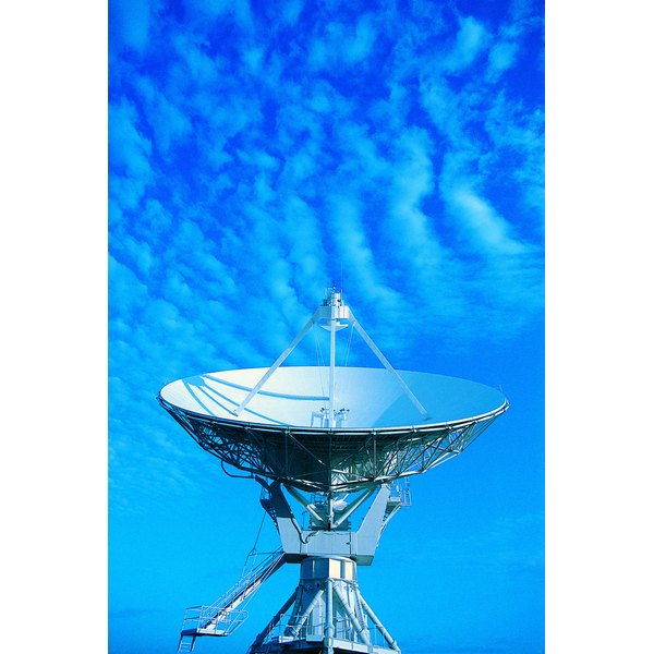 Photodisc/Photodisc/Getty Images Satellite dish pointing towards sky