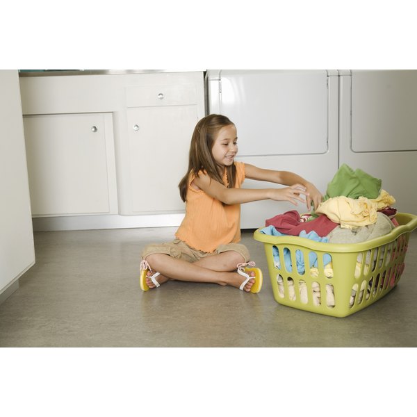 Jupiterimages/Brand X Pictures/Getty Images Girl folding laundry