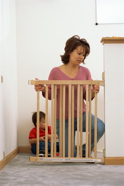 Jupiterimages/liquidlibrary/Getty Images Stop struggling with adjustable commercial dog and baby gates and build your own customizable one.