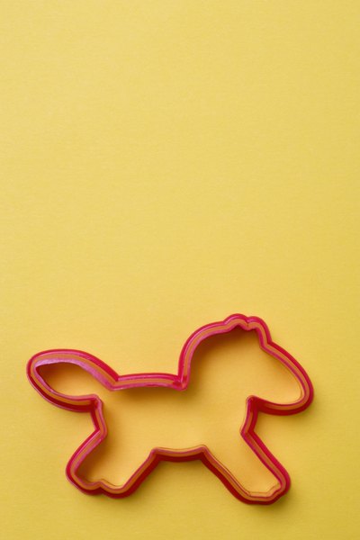 Jupiterimages/Polka Dot/Getty Images Use a cookie cutter, drinking glass or biscuit cutter for easy dog treat shapes.