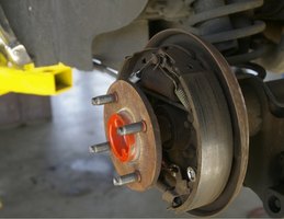 What are some reasons for brakes sticking?