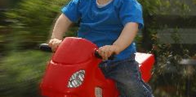 toddler on bike image by cat from Fotolia.com Taking away a toddler's toy can be an effective discipline method.