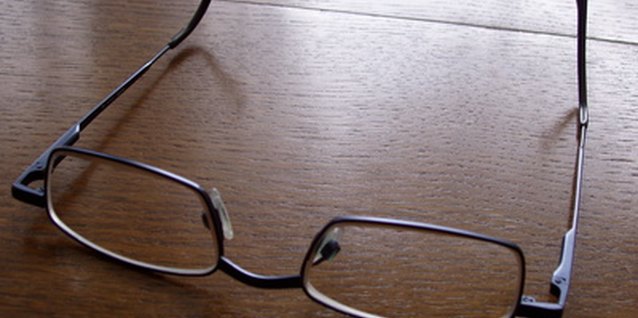 glasses image by PhotographerOne from Fotolia.com Add new beauty tips to help bring out your eyes, even behind eye glasses.