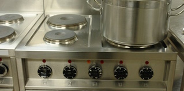 professional cooking range with pot image by Canakris from Fotolia.com Professionally equipped kitchens feature many gadgets in a limited amount of space.