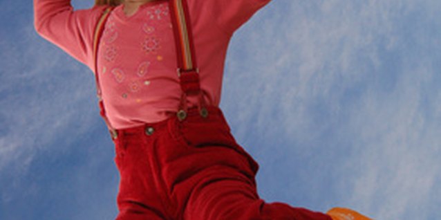 happy jumping girl image by Daria Miroshnikova from Fotolia.com Jumping games provide preschoolers fun fitness and large motor development.