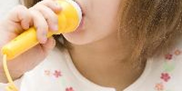 Singing image by anna karwowska from Fotolia.com Singing can help shy toddlers and preschoolers open up.