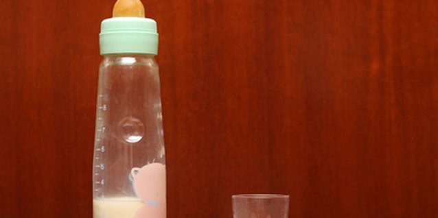 baby's bottle image by Georgios Alexandris from Fotolia.com Bottles should be given up as early as possible.