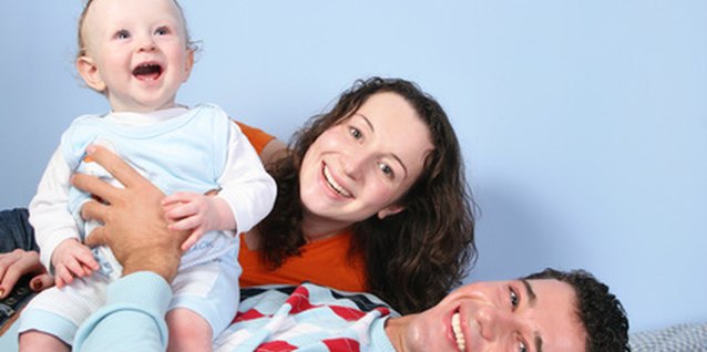 happy family on bed image by Pavel Losevsky from Fotolia.com It is possible to wean your toddler and continue co-sleeping.