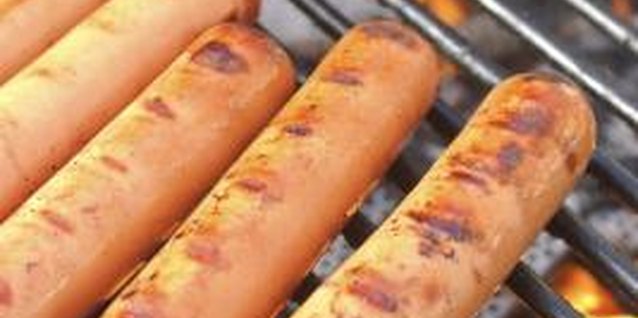 Jupiterimages/Comstock/Getty Images Hot dogs are processed meat with lots of calories and fat.