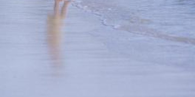 Steve Mason/Stockbyte/Getty Images Let your toddler splash at the water's edge.