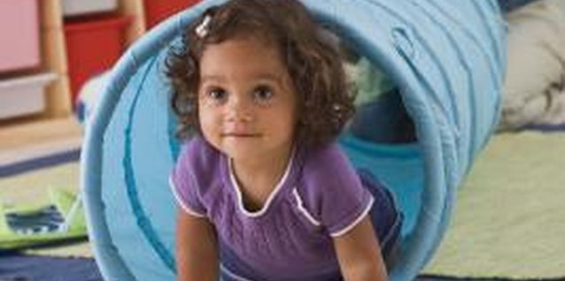 Jupiterimages/Comstock/Getty Images Wear out your toddler as she learns through movement.