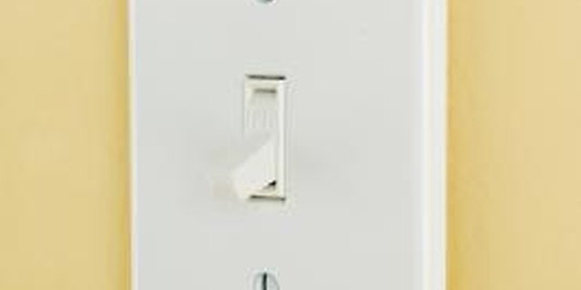 Jupiterimages/Comstock/Getty Images Turn a plastic light switch cover into a decoupage masterpiece.
