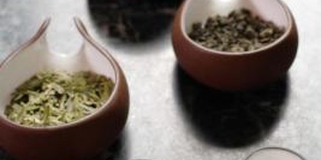 Jupiterimages/Goodshoot/Getty Images Both caffeinated and decaffeinated teas leaves are safe for use in the garden.