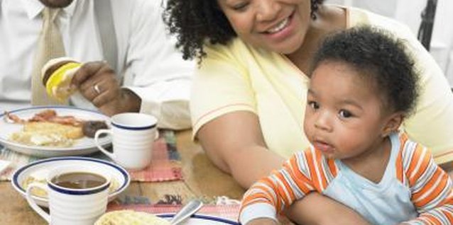 Digital Vision./Digital Vision/Getty Images Toddlers learn early what good table manners look like.