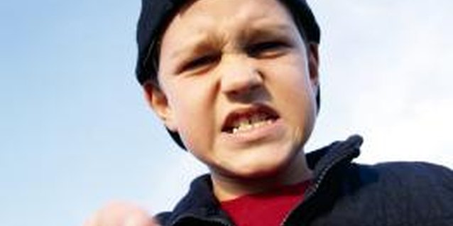 Brand X Pictures/Brand X Pictures/Getty Images Some bullies use their size to gain a sense of power.