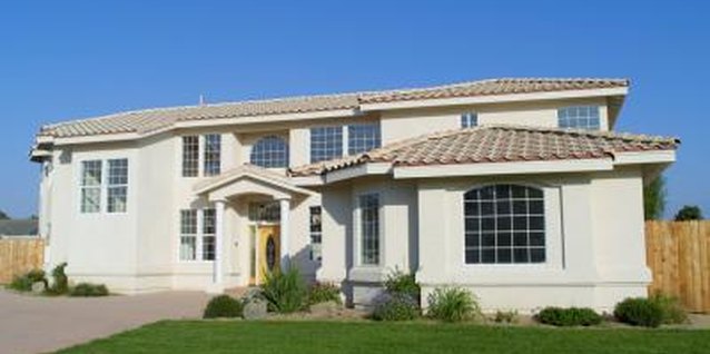 Brand X Pictures/Brand X Pictures/Getty Images Podocarpus trees work best on large areas like lawns or near patios.