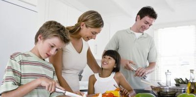 Jupiterimages/Pixland/Getty Images Kids' eating habits improve when they help in the kitchen.