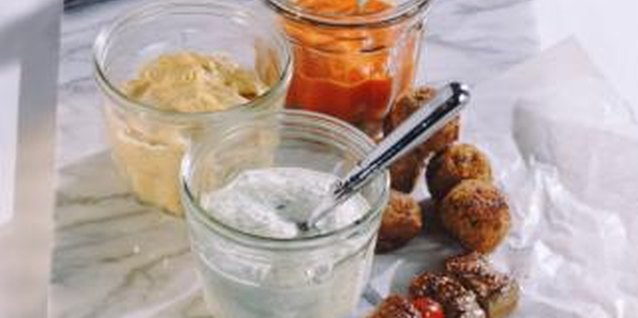 John Foxx/Stockbyte/Getty Images Use yogurt to make both sweet and savory sauces.