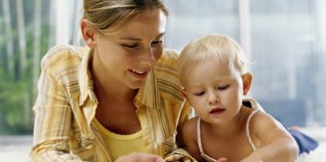 Kraig Scarbinsky/Digital Vision/Getty Images Toddlers enjoy colorful illustrations and lively stories.