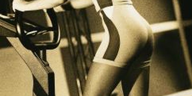 Stockbyte/Stockbyte/Getty Images Using the stair stepper helps you burn calories to lose fat all over your body.
