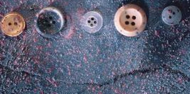 Comstock Images/Comstock/Getty Images Define the shape of the valance with a line of buttons.