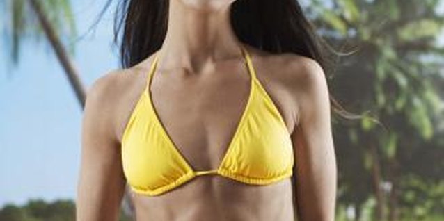 Jupiterimages/Comstock/Getty Images Killer abs require more than just crunches.