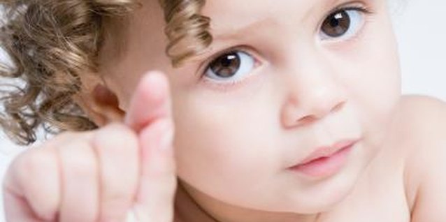 Jupiterimages/Photos.com/Getty Images You can encourage but not force right hand use.