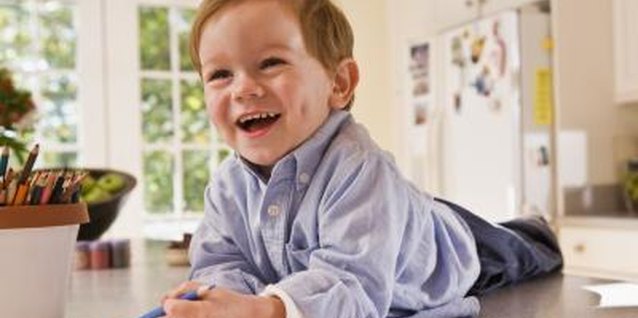 Jupiterimages/Comstock/Getty Images Young toddlers love the sensation of holding a pencil and writing with it.