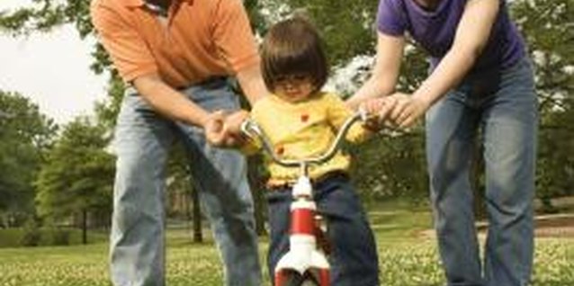Jupiterimages/Comstock/Getty Images A toddler's first wheels can be exciting but also a little scary.