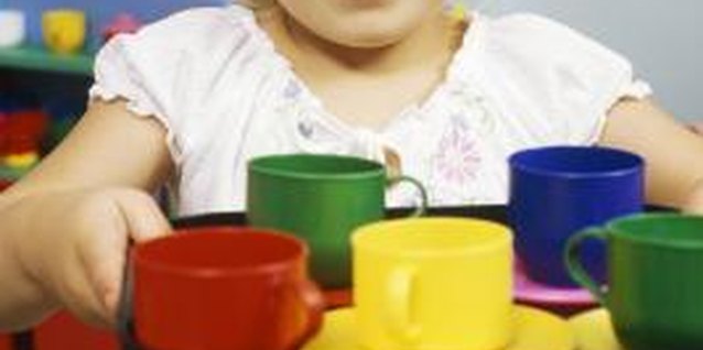 Stockbyte/Stockbyte/Getty Images Your little one learns about positive character by observing and imitating you.