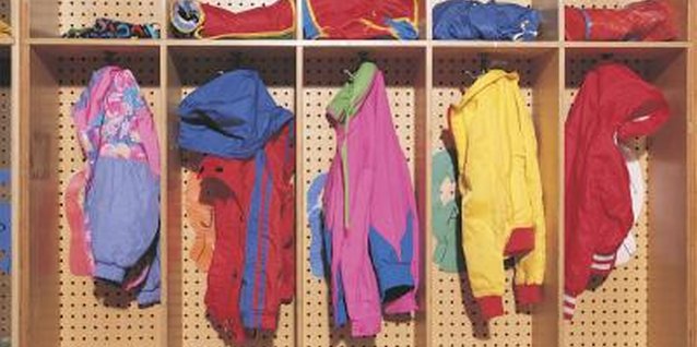 Comstock/Comstock/Getty Images Create a wall cubicle for each child to hang jackets and backpacks.