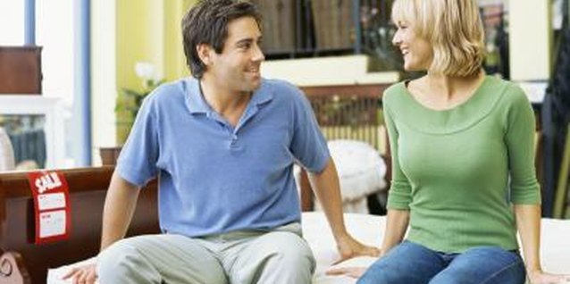 George Doyle/Stockbyte/Getty Images Test mattresses together to find one that meets both of your needs.