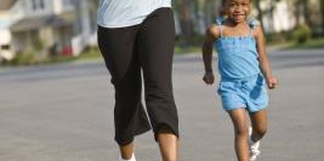 Jupiterimages/Comstock/Getty Images Lead by example as you teach your little one about health and wellness.