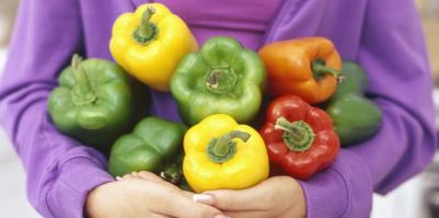 Stockbyte/Stockbyte/Getty Images Variety, timing and growing conditions affect pepper size.