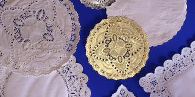 Jupiterimages/Comstock/Getty Images Stiffen crochet doilies with liquid starch or sugar water.