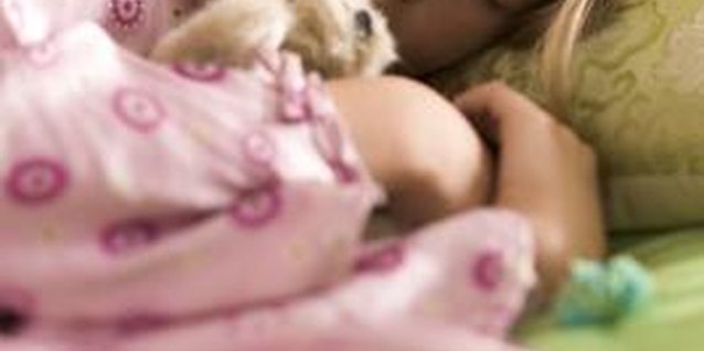 Photodisc/Digital Vision/Getty Images As cozy as her bed may be, help her rise and shine in the morning.