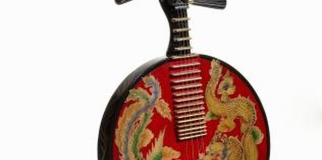 Henry Gan/Photodisc/Getty Images Ethnic musical instruments can be wall sculptures in your home.